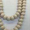 A fashionable and trendy stainless steel necklace with multiple sets of off-white glass beads Item Picture